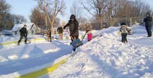 Bondin-Belfast 4-H Club members clear rink for broom hockey in the Fulda City Park